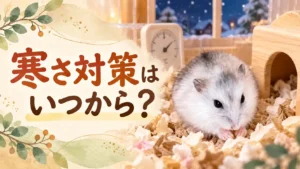 寝起きで巣材の山から顔を出すハム次郎